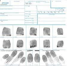 A fingerprint card showing various inked fingerprints, with spaces for personal information and individual finger prints.